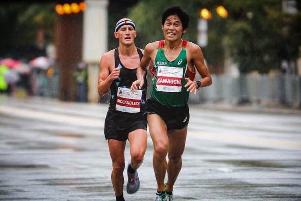 America's Tyler McCandless and Japan's Yuki Kawauchi encounter at the Chicago Marathon