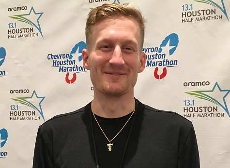 A year ago, Reed Fischer paid his own way to the Aramco Houston Half-Marathon this year he is excited for his return